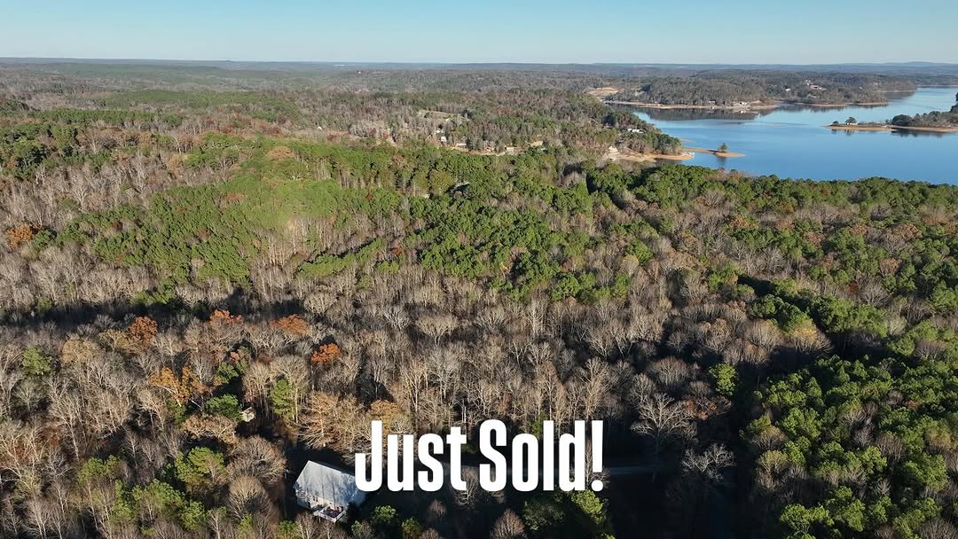 Aerial view of a sold lakeside land parcel